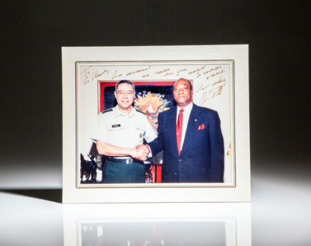 Signed photograph of the Chairman of the Joint Chiefs of Staff, General Colin Powell, with the United States Ambassador to the United Nations, Edward J. Perkins.