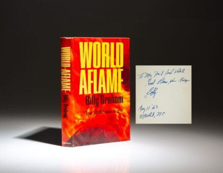 Signed first edition of World Aflame by Billy Graham, inscribed to White House Special Assistant Jack Valenti.