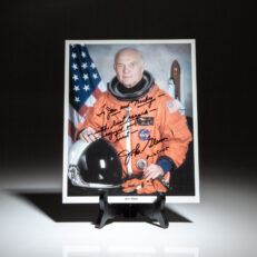 Photograph of astronaut John Glenn inscribed to Hollywood legend, Mickey Rooney and his wife, Jan Rooney.