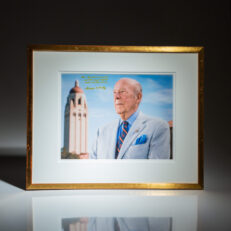 Photograph of former Secretary of State, George P. Shultz, inscribed to media mogul, Rupert Murdoch.