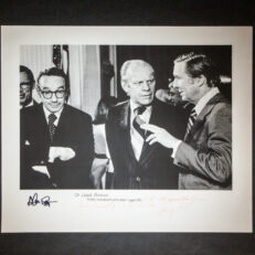 Photograph of President Gerald R. Ford, Senator Lloyd Bentsen and Alan Greenspan, inscribed by President Ford to Senator Bentsen. Additionally signed by Alan Greenspan. This photograph was taken on September 5th, 1974 at the Conference on Inflation, held in the East Room of the White House.