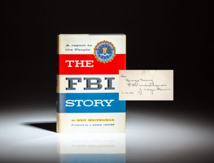 First edition of The FBI Story: A Report to the People by Don Whitehead, inscribed by FBI Director J. Edgar Hoover to the founder of the AFL-CIO, George Meany.