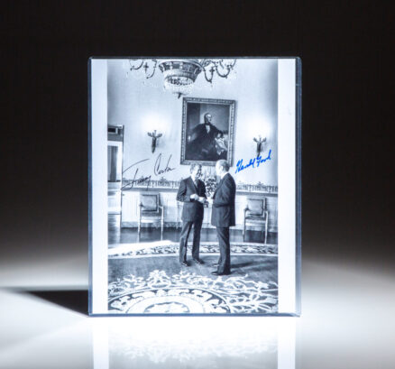 Signed photograph of President Gerald R. Ford and President-elect Jimmy Carter at the White House.