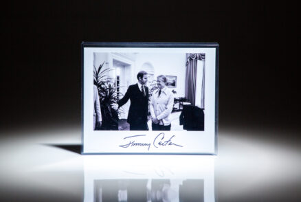 Signed photograph of President Jimmy Carter with Senator Joe Biden in the Oval Office on October 19th, 1979.