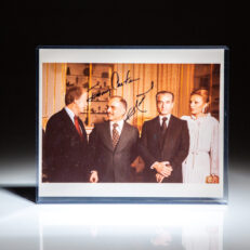 Signed photograph of President Jimmy Carter, standing next to King Hussein of Jordan, the Last Shah of Iran, Mohammed Reza Pahlavi, and his wife, Farah Pahlavi.