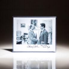 Signed photograph of President Jimmy Carter in the Oval Office, meeting with Senator Birch Bayh of Indiana.