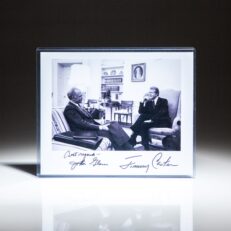 Signed photograph of President Jimmy Carter with Senator John Glenn in the Oval Office.