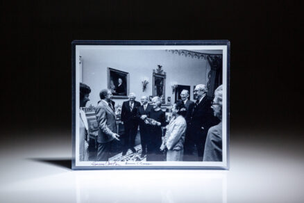 Photograph of President Carter meeting with the Justices of the Supreme Court and their wives, signed by President Jimmy Carter and Chief Justice Warren E. Burger.