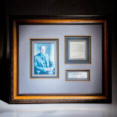 Signed copy of President Gerald R. Ford's pardon of Richard Nixon, framed with color photograph of Ford.