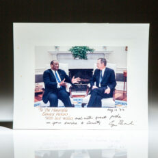 Photograph of President George H.W. Bush greeting the new United States Ambassador to the United Nations, the Hon. Edward J. Perkins. Official White House photograph, dated May 12, 1992 on verso.