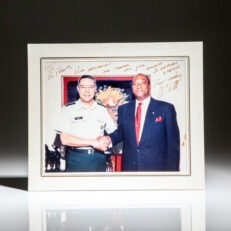 Signed photograph of the Chairman of the Joint Chiefs of Staff, General Colin Powell, with the United States Ambassador to the United Nations, Edward J. Perkins.