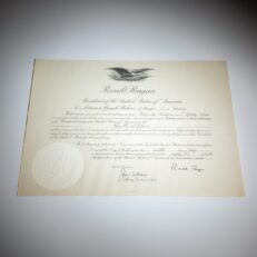 Appointment of Edward J. Perkins as the United States Ambassador to the Republic of Liberia, includes the White House letter detailing his mission objectives and his official appointment from President Ronald Reagan. Both items signed in autopen by President Reagan.