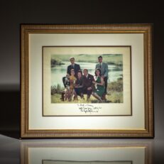 Inscribed photograph of the Johnson Family on the banks of the Pedernales River near Stonewall, Texas. This photograph was taken on September 30, 1967 by White House photographer Yoichi Okamoto.