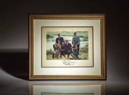 Inscribed photograph of the Johnson Family on the banks of the Pedernales River near Stonewall, Texas. This photograph was taken on September 30, 1967 by White House photographer Yoichi Okamoto.