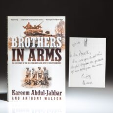 First paperback edition of Brothers in Arms by Kareem Abdul-Jabbar, inscribed to former Secretary of State Colin Powell.