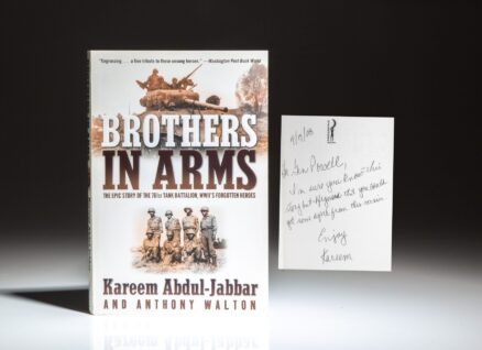 First paperback edition of Brothers in Arms by Kareem Abdul-Jabbar, inscribed to former Secretary of State Colin Powell.