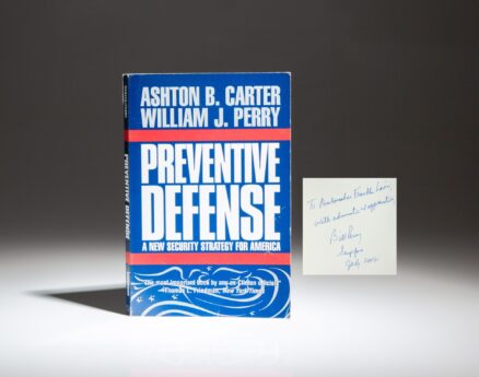 Inscribed to the United States Ambassador to Singapore Franklin Lavin, the first paperback edition of Preventive Defense by Ashton B. Carter and William J. Perry.