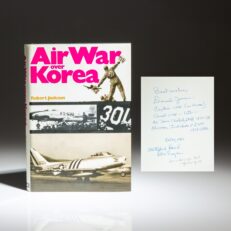 First edition of Air War Over Korea by Robert Jackson, inscribed by Chairman of the Joint Chiefs of Staff, Gen. David C. Jones, and Medal of Honor recipient, Capt. Thomas J. Hudner, Jr. The story of Capt. Hudner was recently told by author Adam Makos in his book, and Hollywood movie of the same name, Devotion.