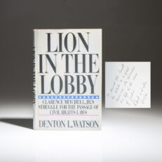 Inscribed to Chairman of the Joint Chiefs of Staff Colin Powell, the first edition of Lion in the Lobby by Denton L. Watson.