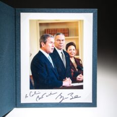 The swearing-in ceremony for Secretary of State Colin Powell in the Oval Office on January 26, 2001, inscribed by President George W. Bush.