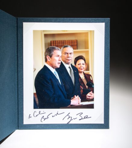 The swearing-in ceremony for Secretary of State Colin Powell in the Oval Office on January 26, 2001, inscribed by President George W. Bush.