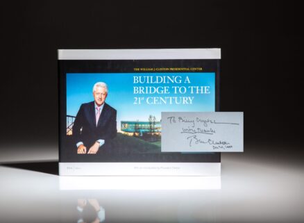 Inscribed to actor and comedian Billy Crystal, the first printing of The William J. Clinton Presidential Center: Building A Bridge to the 21st Century.