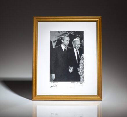 From the Funeral of Thurgood Marshall, an inscribed photograph of Justice David H. Souter and his predecessor, William J. Brennan, entering the Great Hall of the Supreme Court. Justice Souter is holding hands with Brennan, who was unsteady after a recent stroke.