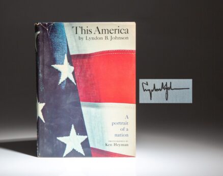 Signed first edition of This America by President Lyndon B. Johnson, with a note from his daughter Lynda stating that this was "one of the last he signed."